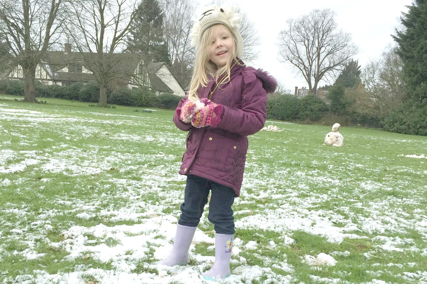 Little G building a snowman