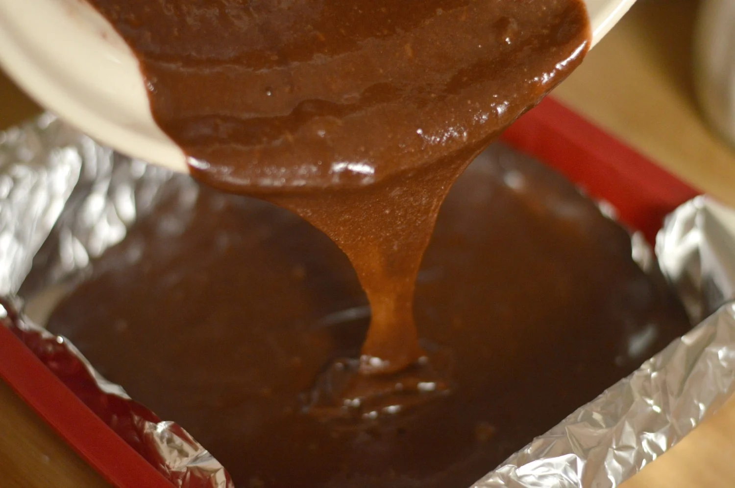 Pouring the brownie mix