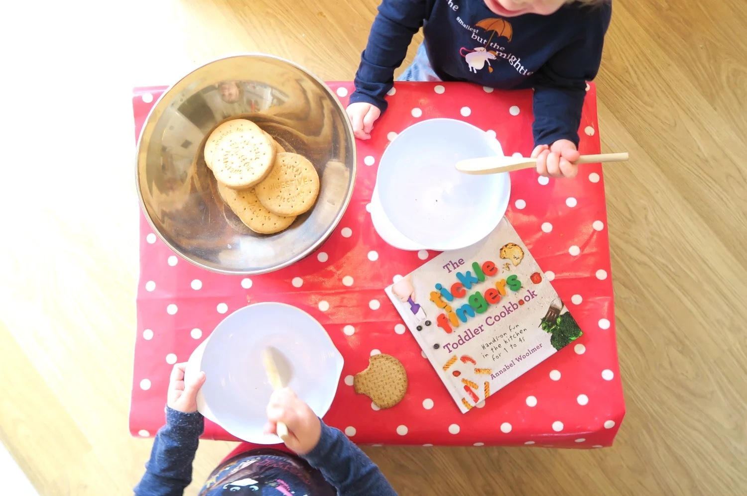 Two toddlers cooking