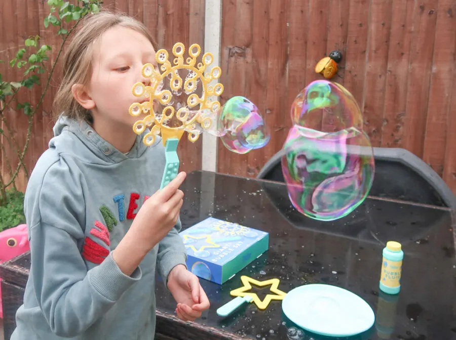 Child blowing bubbles