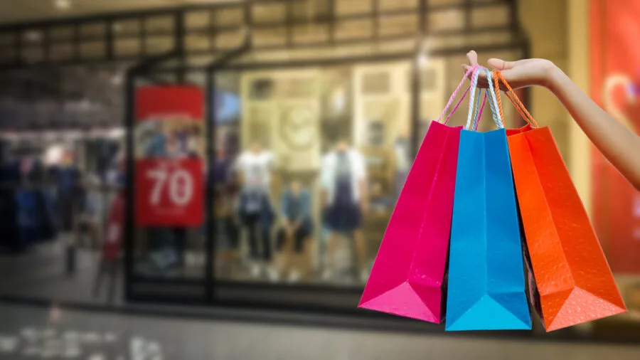 woman arm holding shopping bags