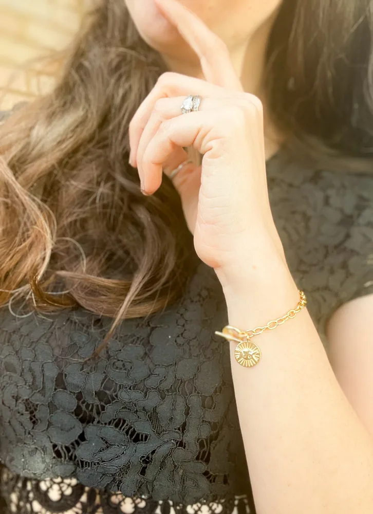 Estée Lalonde Goddess Medallion on womans wrist