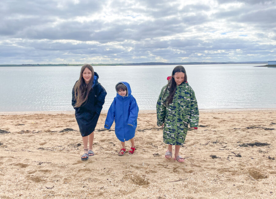Three kids wearing Regatta kids changing robes