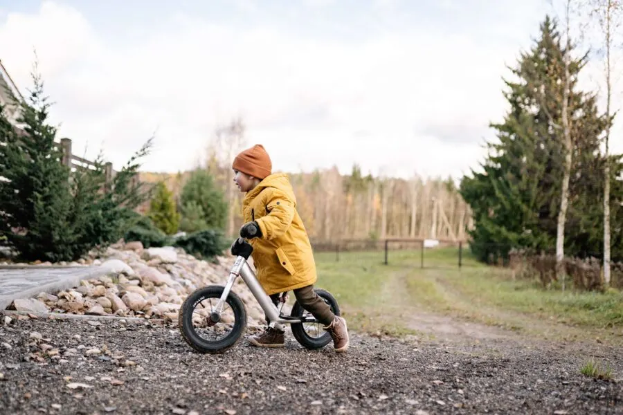 Child riding a balance bike