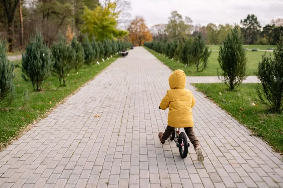 child on balance bike