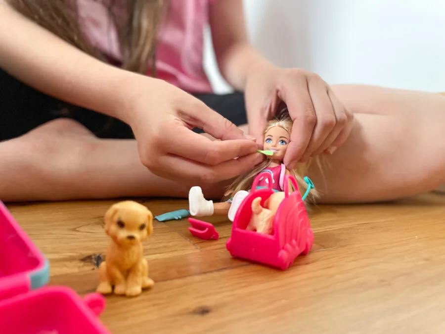 Girl playing with travel chelsea