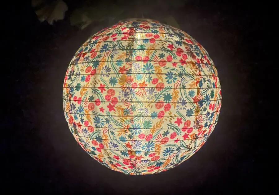 floral solar lantern at night