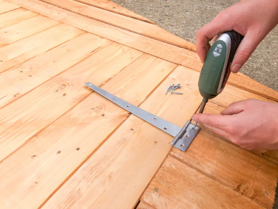 Attaching hinges to bike shed doors