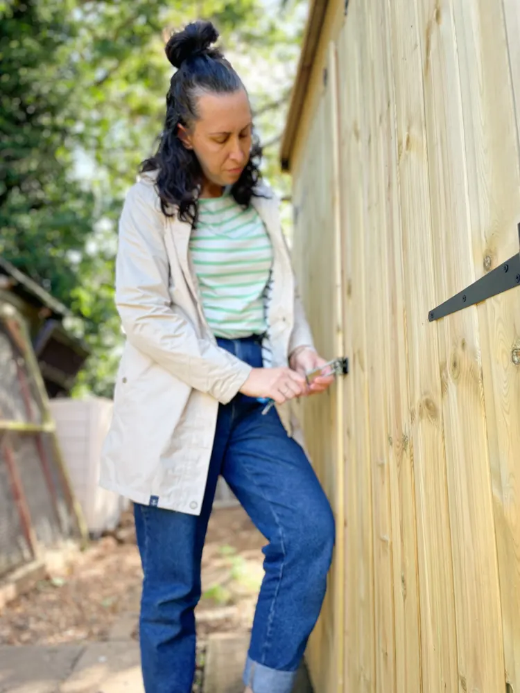 woman opening shed door lock