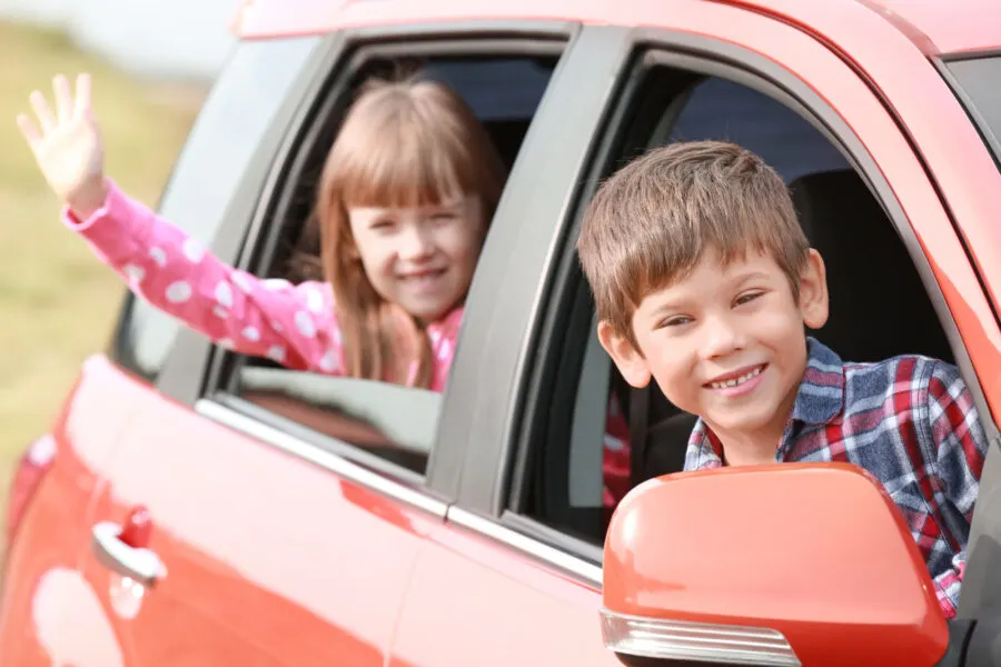 children looking out of car window