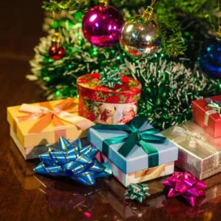Christmas gifts under a Christmas tree