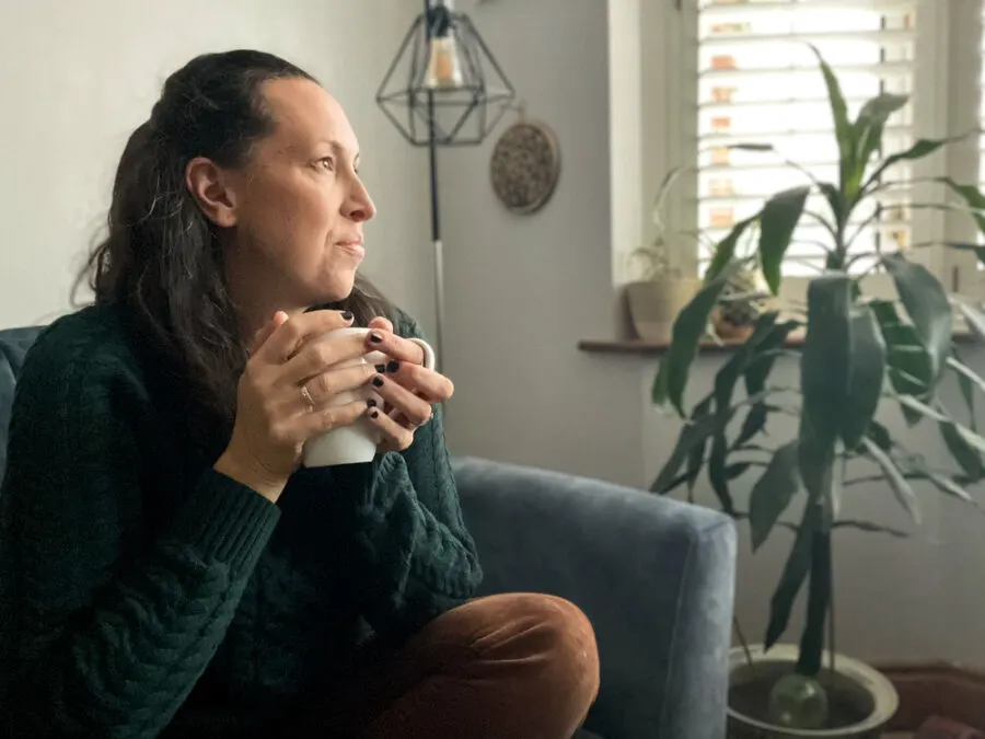 Woman smiling looking out window