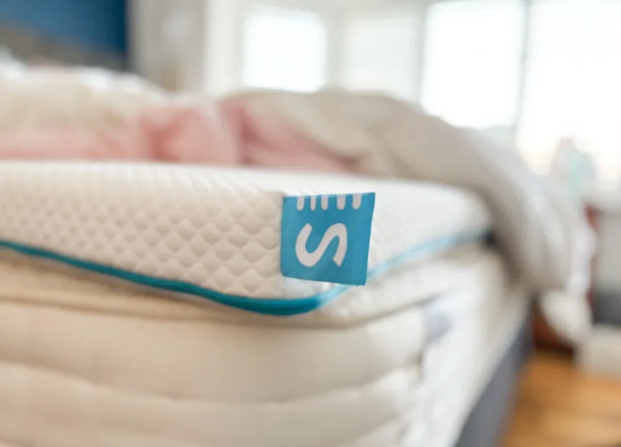 Simba Hybrid Essential mattress topper on the bed