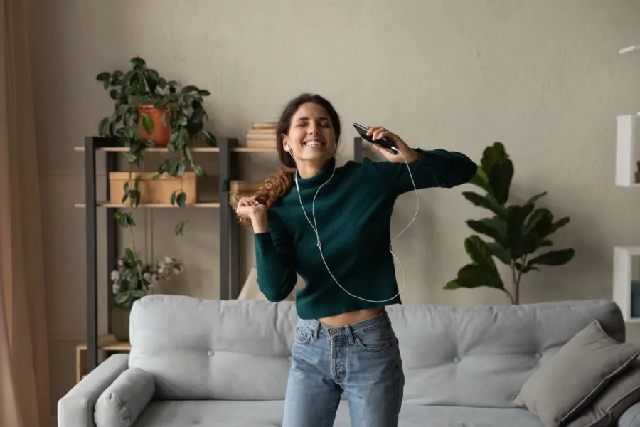 girl dancing alone in an apartment